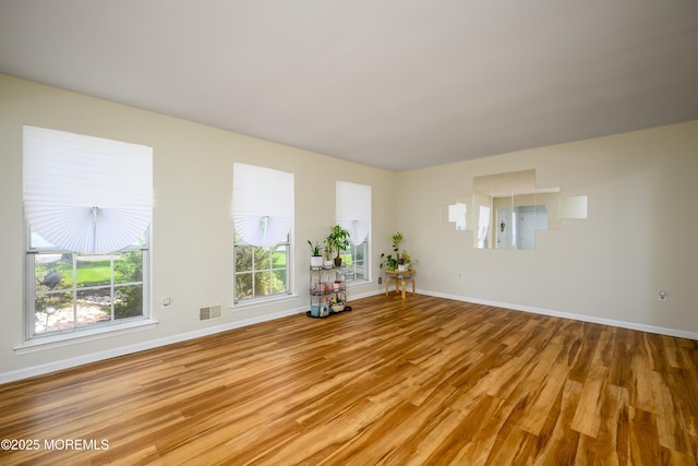 14 Winfield Dr, Manalapan, NJ 07726 - unfurnished living room with wood finished floors and baseboards