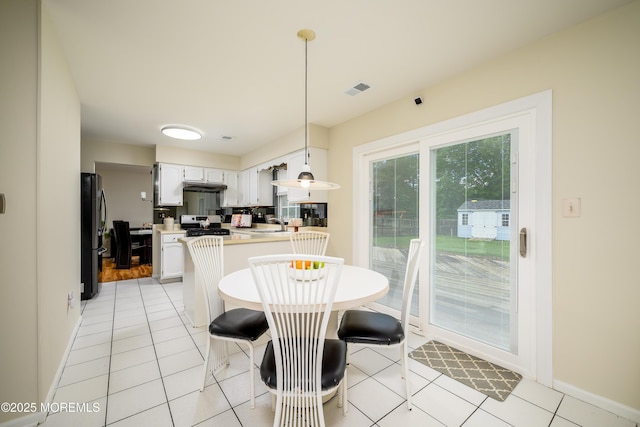 14 Winfield Dr, Manalapan, NJ 07726 - dining area with light tile patterned flooring and baseboards