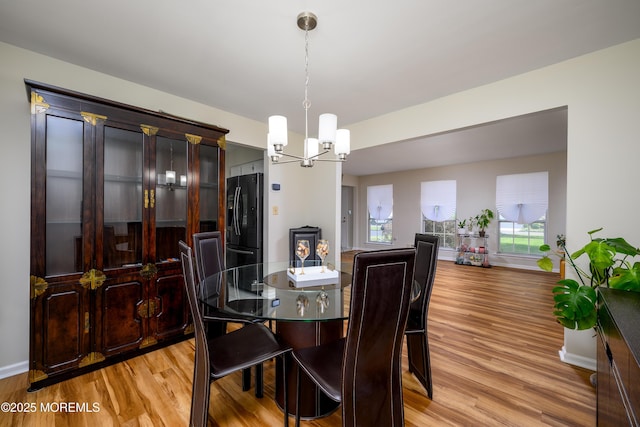 14 Winfield Dr, Manalapan, NJ 07726 - dining area featuring light wood finished floors, a chandelier, and baseboards
