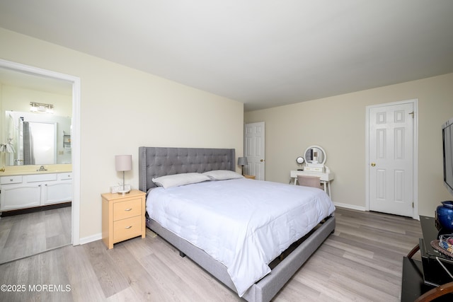 14 Winfield Dr, Manalapan, NJ 07726 - bedroom with light wood-style floors, ensuite bath, and baseboards