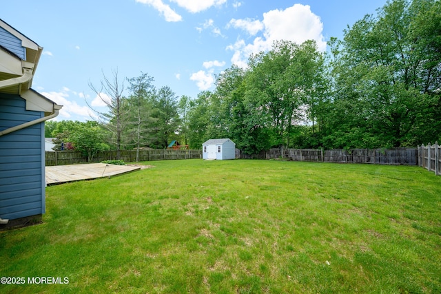 14 Winfield Dr, Manalapan, NJ 07726 - view of yard featuring a deck and view of scattered trees