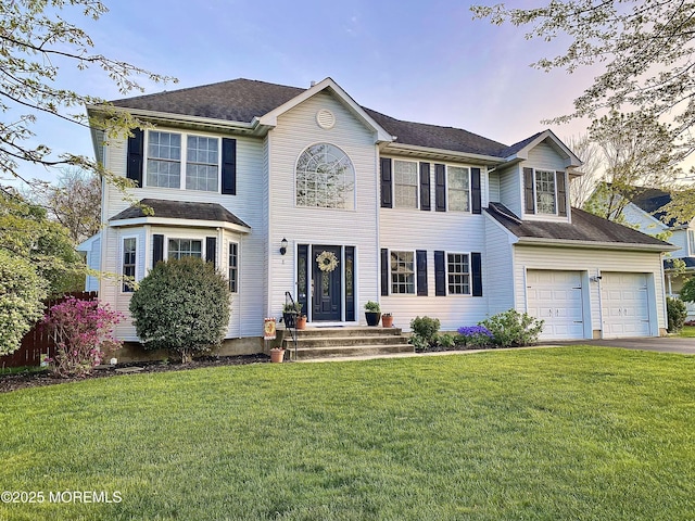 8 Augusta St, Wrightstown, NJ 08562 - colonial-style house featuring driveway, a front lawn, and an attached garage
