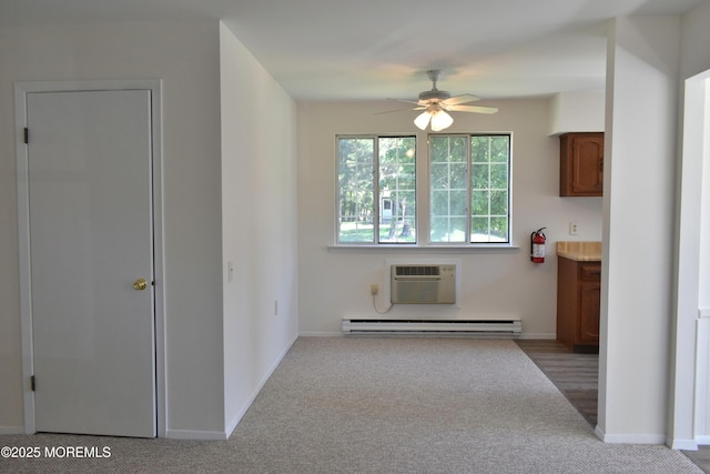 29A Easton Dr Unit 61, Whiting, NJ 08759 - kitchen featuring a wall mounted AC, carpet flooring, ceiling fan, a baseboard radiator, and baseboards