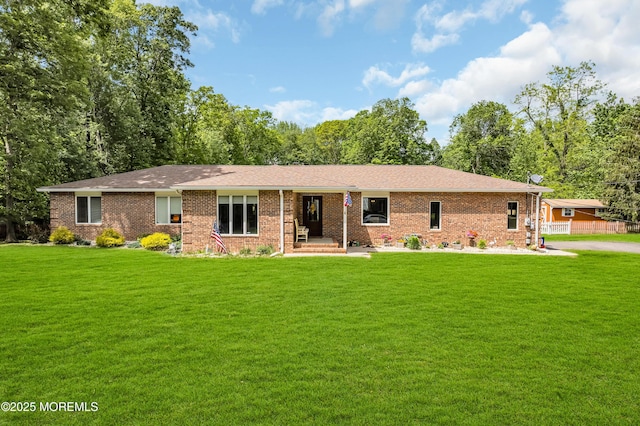 3 Stoney Brook Trl, Howell, NJ 07731 - ranch-style house with a front lawn, brick siding, and a shingled roof