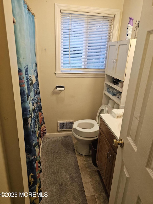 906 Egret Dr, Toms River, NJ 08753 - bathroom with tile patterned flooring, toilet, vanity, baseboards, and curtained shower