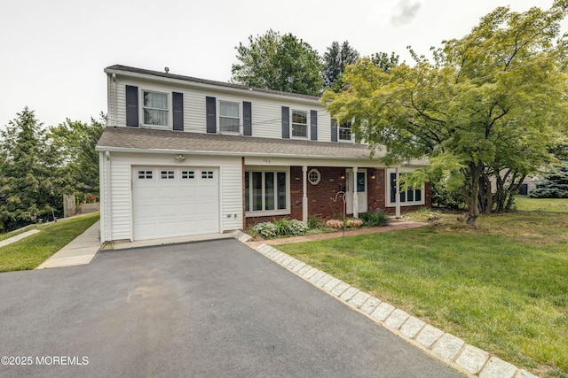 153 12th St, Belford, NJ 07718 - traditional-style house with driveway, a front yard, and an attached garage