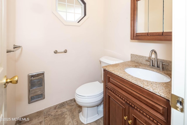 153 12th St, Belford, NJ 07718 - bathroom with heating unit, toilet, and vanity