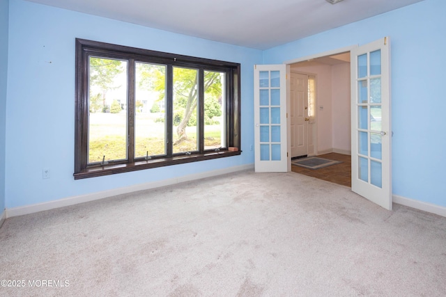 153 12th St, Belford, NJ 07718 - unfurnished room featuring french doors, carpet floors, and baseboards