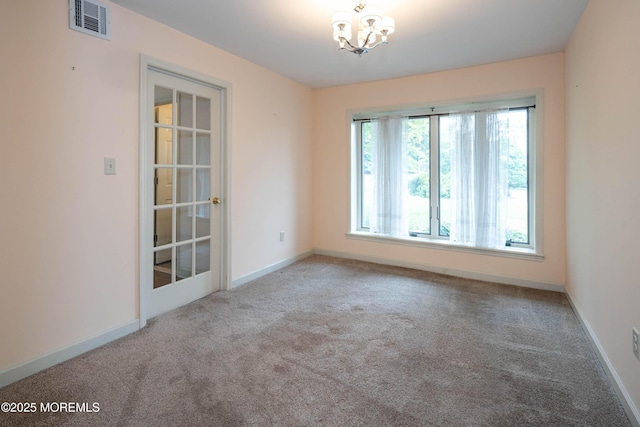 153 12th St, Belford, NJ 07718 - empty room featuring carpet flooring, a chandelier, and baseboards