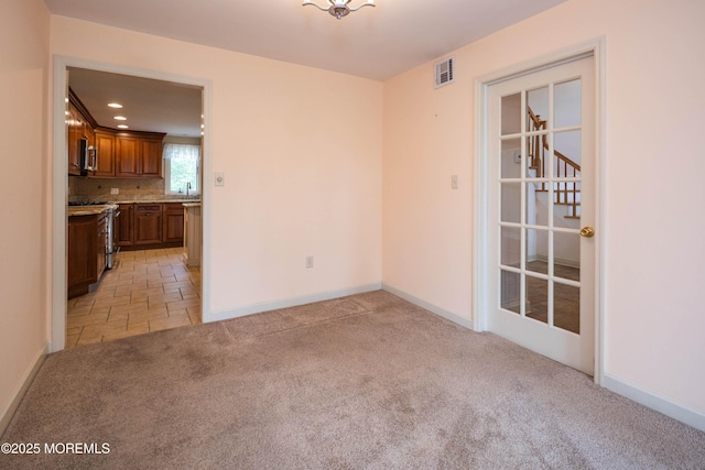 153 12th St, Belford, NJ 07718 - spare room featuring light colored carpet, baseboards, a sink, and recessed lighting