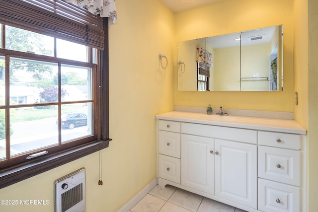 153 12th St, Belford, NJ 07718 - bathroom featuring vanity, heating unit, baseboards, and marble finish floors