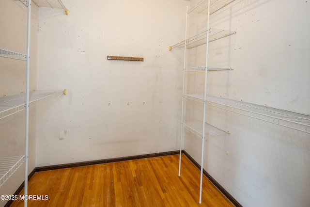 153 12th St, Belford, NJ 07718 - walk in closet featuring wood finished floors