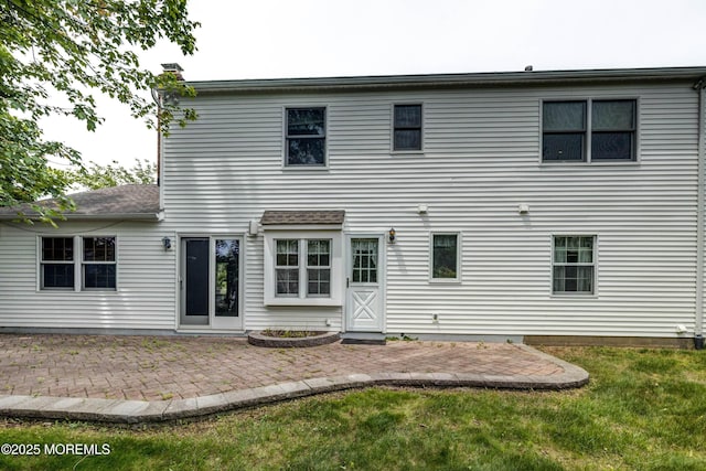 153 12th St, Belford, NJ 07718 - rear view of house featuring a yard, a chimney, and a patio