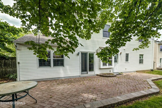 153 12th St, Belford, NJ 07718 - rear view of property featuring a patio