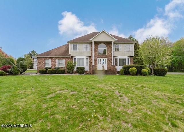 1 Alexander Dr, Monroe, NJ 08831 - view of front of house with brick siding and a front lawn