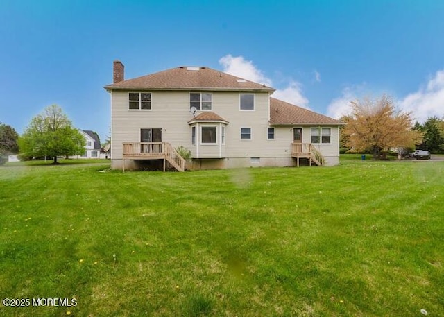 1 Alexander Dr, Monroe, NJ 08831 - rear view of property featuring a chimney and a lawn
