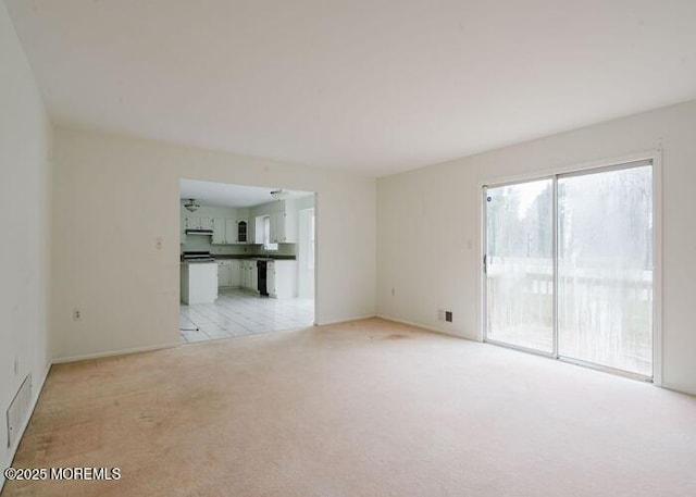 1 Alexander Dr, Monroe, NJ 08831 - unfurnished living room featuring light carpet