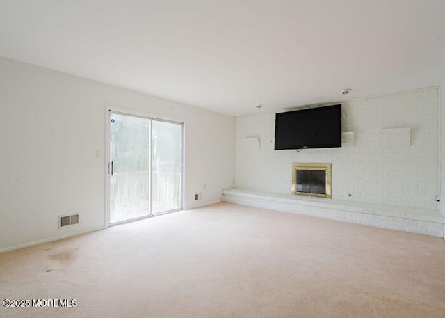 1 Alexander Dr, Monroe, NJ 08831 - unfurnished living room with carpet flooring and a fireplace
