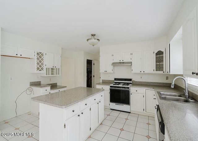 1 Alexander Dr, Monroe, NJ 08831 - kitchen featuring white gas range, a sink, under cabinet range hood, dishwasher, and a kitchen island
