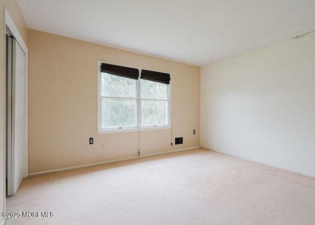 1 Alexander Dr, Monroe, NJ 08831 - unfurnished bedroom with light carpet and a closet