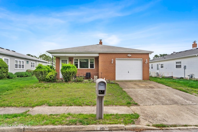 14 Tijuana Ct, Toms River, NJ 08757 - view of front of house with brick siding, an attached garage, a front lawn, and driveway