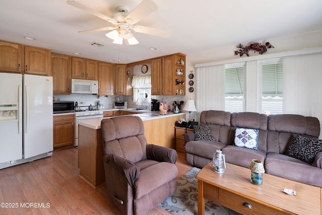 14 Tijuana Ct, Toms River, NJ 08757 - kitchen featuring white appliances, open floor plan, light countertops, light wood-type flooring, and ceiling fan