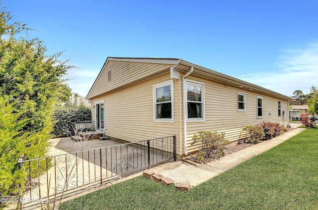 3 Virgin Islands Dr, Toms River, NJ 08757 - view of side of home featuring a yard and a patio