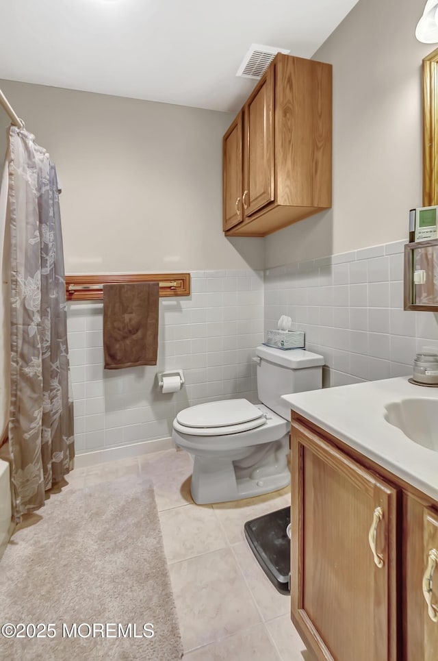 3 Virgin Islands Dr, Toms River, NJ 08757 - bathroom with tile walls, toilet, tile patterned floors, wainscoting, and a shower with shower curtain