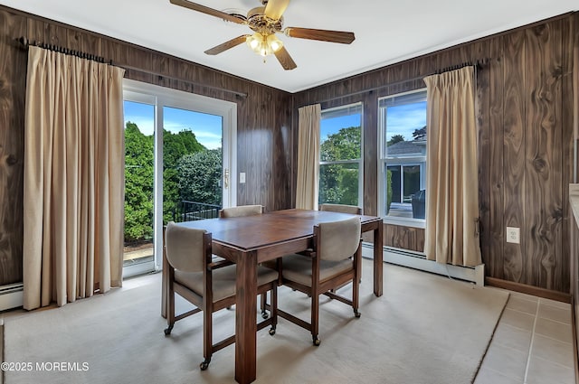 3 Virgin Islands Dr, Toms River, NJ 08757 - dining room with a baseboard radiator, wood walls, ceiling fan, and light tile patterned floors