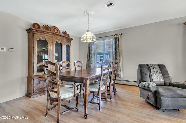 3 Virgin Islands Dr, Toms River, NJ 08757 - dining space featuring a chandelier, a baseboard radiator, and light wood-style flooring