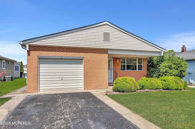 3 Virgin Islands Dr, Toms River, NJ 08757 - view of front facade featuring brick siding, driveway, and a front lawn