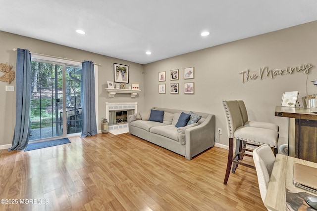 43 Woodledge Ct, Rockaway Twp, NJ 07866 - living room with baseboards, light wood-style flooring, recessed lighting, and a tiled fireplace
