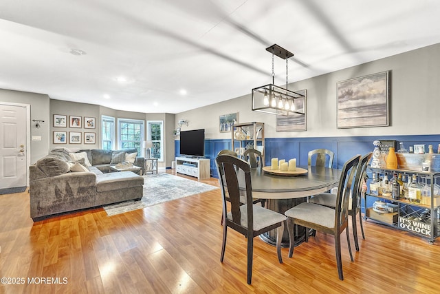 43 Woodledge Ct, Rockaway Twp, NJ 07866 - dining area with light wood finished floors, a wainscoted wall, and recessed lighting