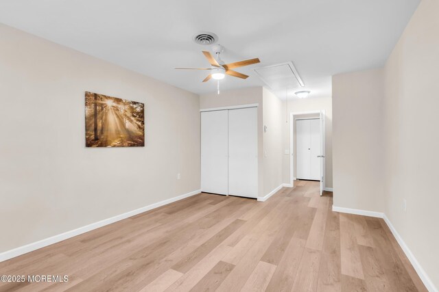 28 Mill Rd Unit B, Whiting, NJ 08759 - unfurnished bedroom with attic access, light wood-style floors, a closet, baseboards, and a ceiling fan