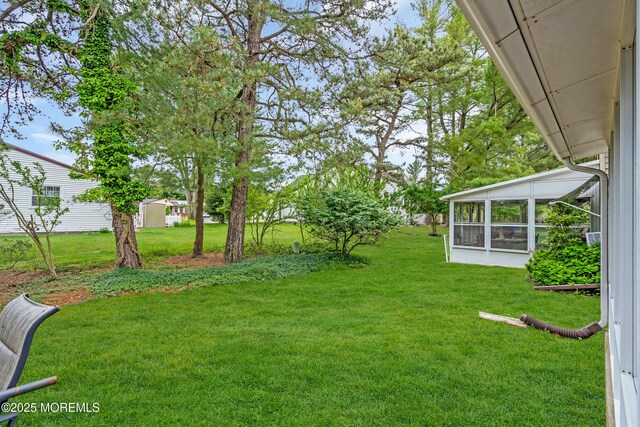 28 Mill Rd Unit B, Whiting, NJ 08759 - view of grassy yard with a sunroom