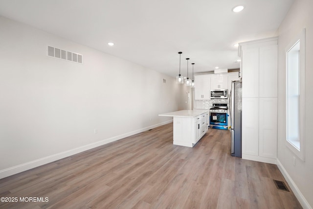 51 Sampson Ave, Seaside Heights, NJ 08751 - kitchen with stainless steel appliances, light countertops, baseboards, decorative backsplash, and recessed lighting
