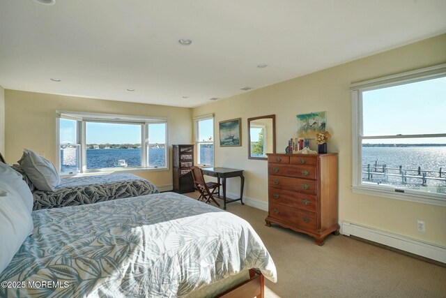 599 Point Ave, Brick, NJ 08724 - bedroom with light colored carpet, a water view, a baseboard radiator, baseboards, and recessed lighting