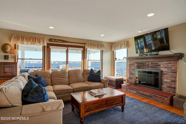 599 Point Ave, Brick, NJ 08724 - living room with wood finished floors, a brick fireplace, and recessed lighting