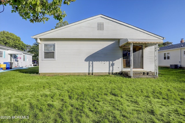 31 Togo Rd, Toms River, NJ 08757 - rear view of house featuring a yard and central AC