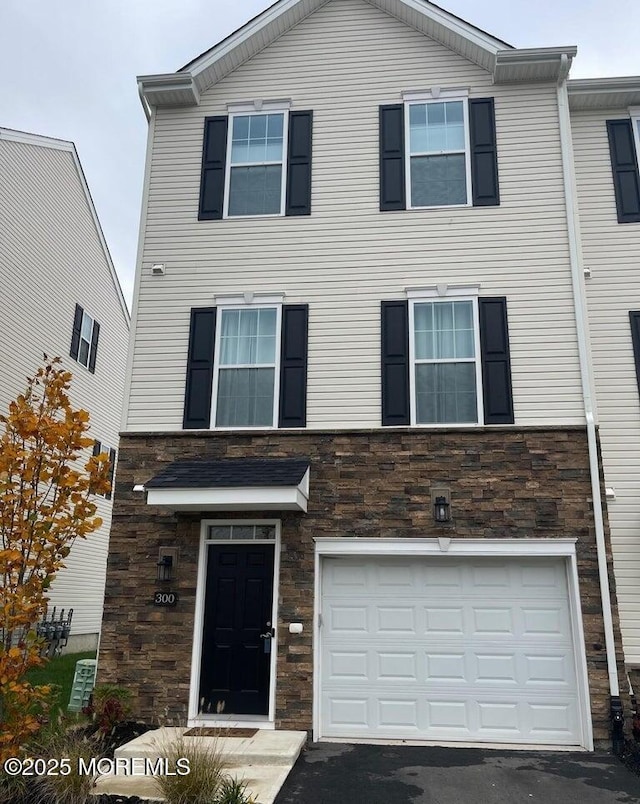 300 Prestige Rd, Brick, NJ 08723 - multi unit property featuring an attached garage, stone siding, and driveway