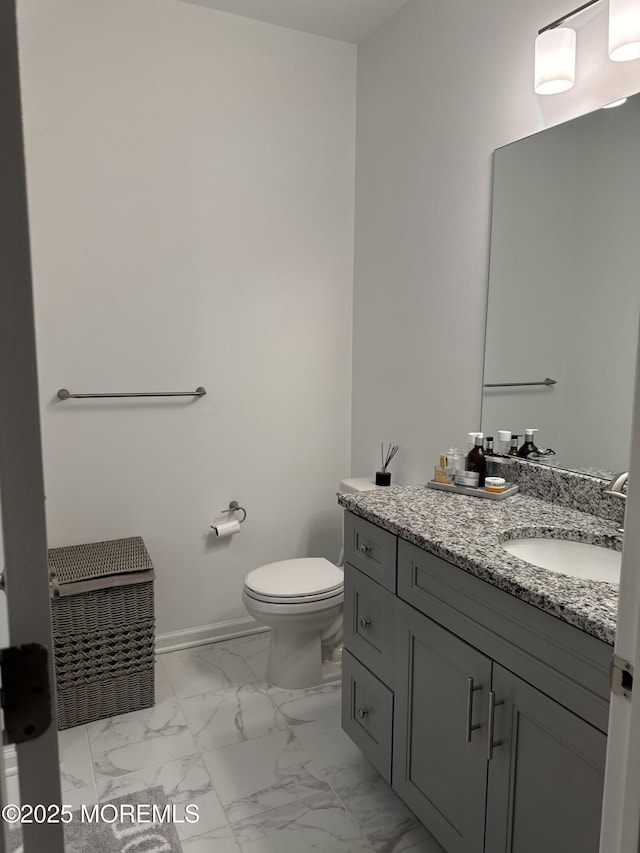 300 Prestige Rd, Brick, NJ 08723 - bathroom featuring marble finish flooring, vanity, toilet, and baseboards