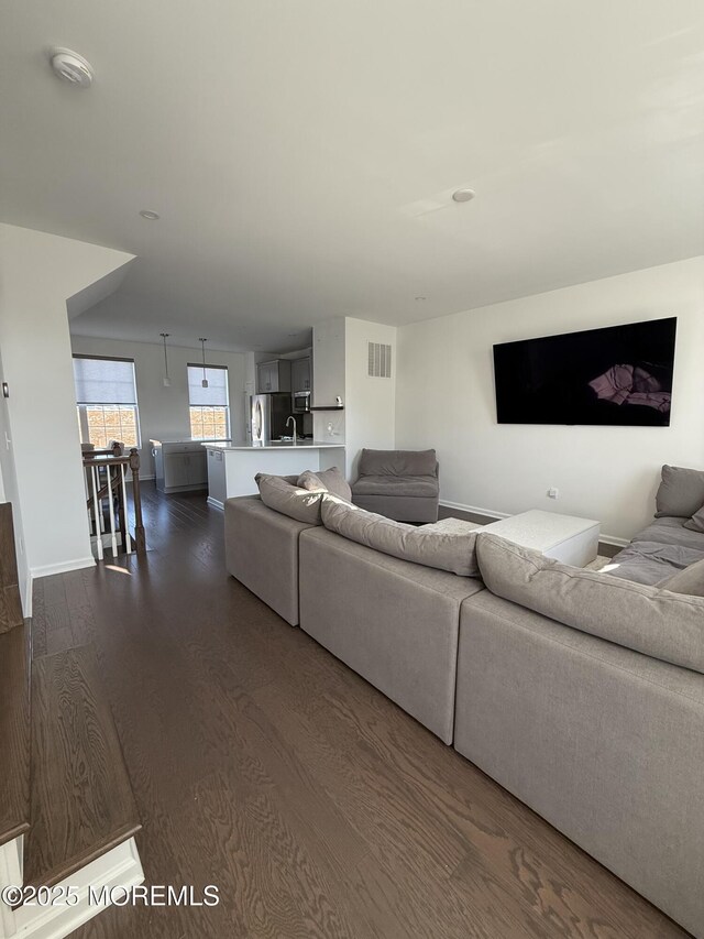 300 Prestige Rd, Brick, NJ 08723 - living area featuring dark wood finished floors and baseboards