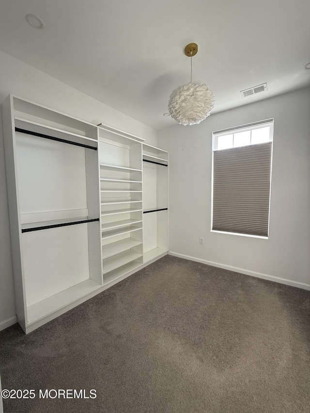 300 Prestige Rd, Brick, NJ 08723 - unfurnished bedroom with dark carpet, baseboards, and a closet