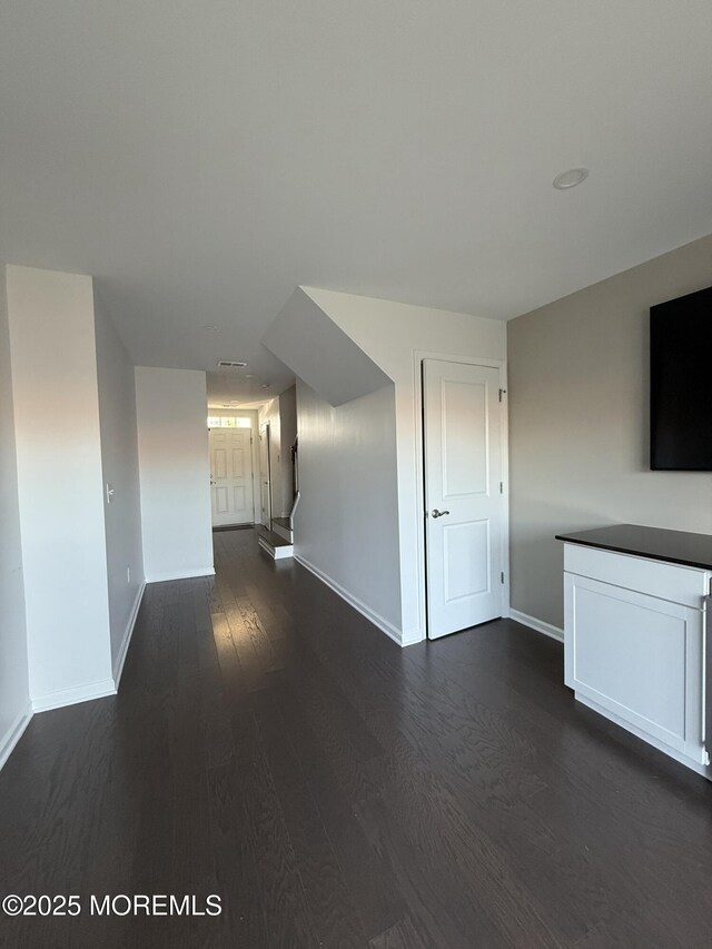 300 Prestige Rd, Brick, NJ 08723 - unfurnished living room with baseboards and dark wood finished floors