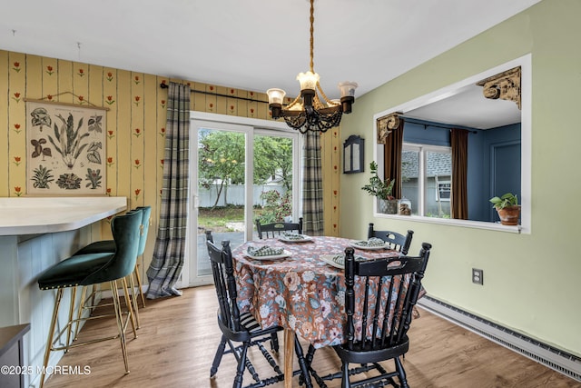 930 Devon St, Forked River, NJ 08731 - dining room with a baseboard radiator, a chandelier, light wood finished floors, and baseboards