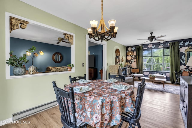 930 Devon St, Forked River, NJ 08731 - dining room featuring a ceiling fan, a baseboard radiator, wood finished floors, and a chandelier