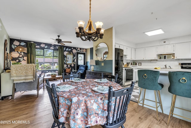 930 Devon St, Forked River, NJ 08731 - dining area featuring a chandelier, light wood-style floors, and ceiling fan