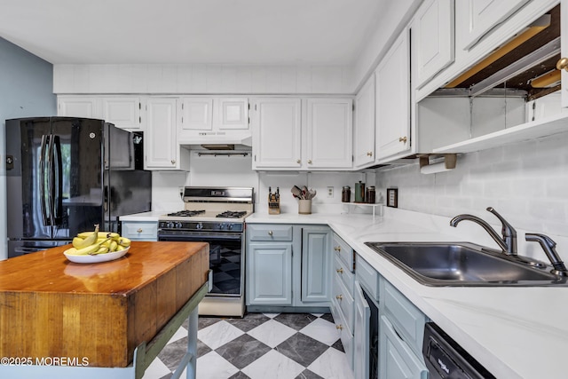 930 Devon St, Forked River, NJ 08731 - kitchen featuring freestanding refrigerator, white range with gas stovetop, a sink, under cabinet range hood, and light countertops