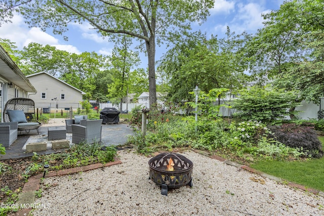 930 Devon St, Forked River, NJ 08731 - fenced backyard with a fire pit and a patio