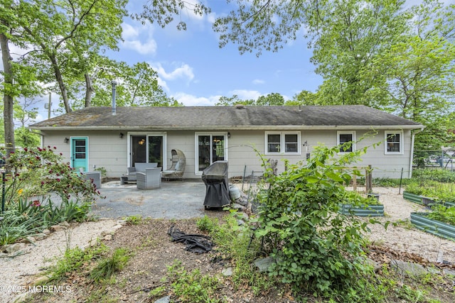 930 Devon St, Forked River, NJ 08731 - rear view of house featuring a vegetable garden and a patio area